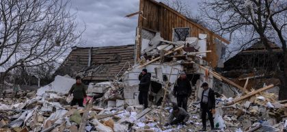 Igor lost his wife and daughter in the Ukraine crisis. He sorts through the rubble, trying to retrieve whatever he can with the help of neighbours. Photo: Stefanie Glinski/Concern Worldwide