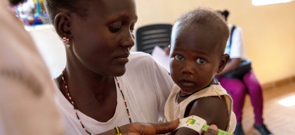 Concern staff members meet Everlyn (29) and her one-year-old at the local health clinic at Loiyangalani. Photo: Gavin Douglas/Concern Worldwide