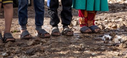 Children standing in mud