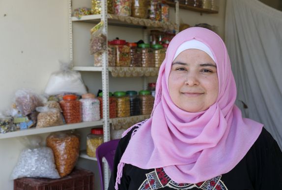Bushra runs a small grocery shop after receiving training and a grant from Concern.