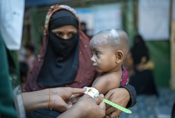 Kulsum* (28) a Rohingya mother visits Concern nutrition centre with her fourth child (15 months) for health examination and to receive ready-to-use therapeutic food (RUTF) in the nutrition centre at Camp 19, Rohingya camp, Ukhiya, Cox's bazar. Photo: Saikat Mojumder/Concern Worldwide