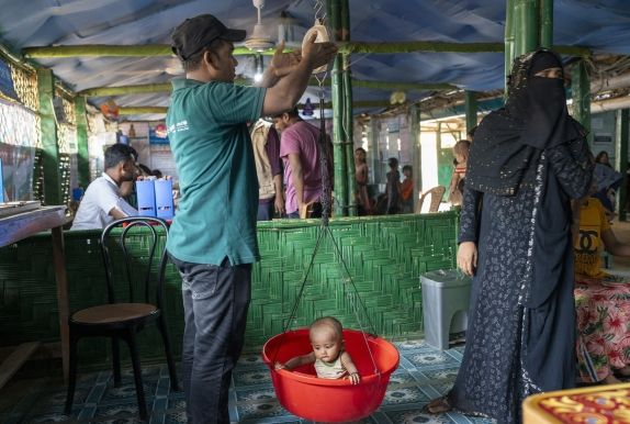 Anwar* being weighed at a Concern nutrition centre in Cox’z Bazar. 