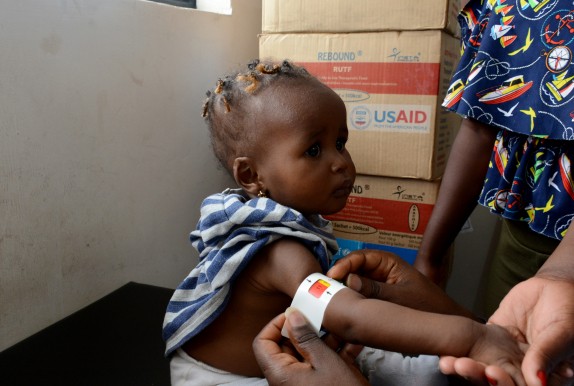 Hawi’s upper arm is measured by a MUAC band, (Mid-Upper Arm Circumference), which helps identify malnutrition.