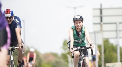 Concern supporter cycling in the AJ Bell London Triathlon