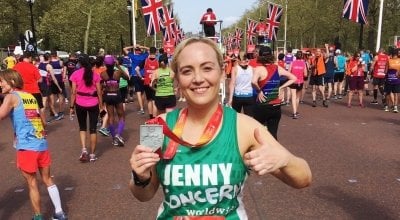 Jenny Flynn standing with her medal, having completed the London Marathon in support of Concern Worldwide UK.
