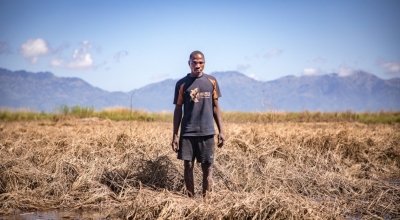 Patrick Ghembo stands with his crops that were destroyed by Cyclone Idai. Photo: Gavin Douglas/ Concern Worldwide.