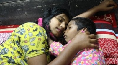 Sadia* (15) and her brother Mahir* sleep safely in a Concern supported Pavement Dweller Centre (PDC)