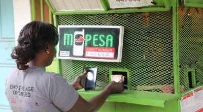 Concern Worldwide's Community Health Volunteer, Isabelle at the M-PESA kiosk, Nairobi, Kenya Picture: Jennifer Nolan