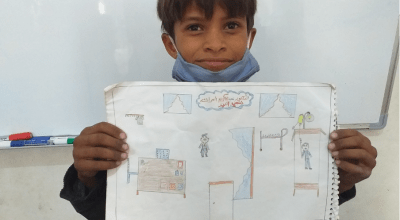 10-year-old Mohamad from Syria draws what he wants to be when he grows up: a doctor.