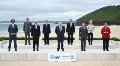 World leaders stand together at the G7