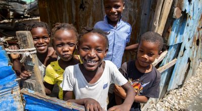 Children smile to camera in Cite Soleil slum, a district of Port-au-Prince, Haiti. Photo: Dieu Nalio Chery/ Concern Worldwide)