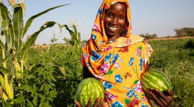 Mahadia Gamar (24) showcases her watermelon at her farm in Karo village. Photo: Eugene Ikua/Concern Worldwide