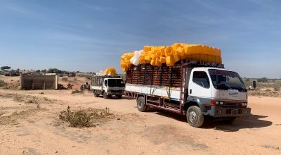 A truck carries aid supplies