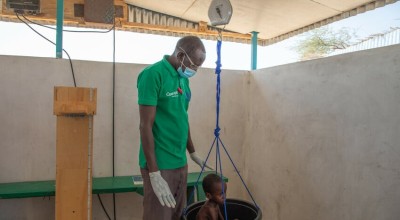 A child is weighed at the Concern health post in Baga Sola, Western Chad. Photo: Eugene Ikua/Concern Worldwide