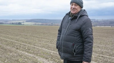 A photo of Ivan Ivan Zakharenko standing in a field.