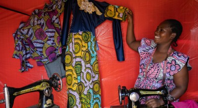 Mother-of-five Alice Masika Nzangura (27) fled to Mangothe with three children in 2022. Her youngest child is one month old. Alice runs a successful dressmaking and fabric selling business. She owns five sewing machines and is training other women to tailor and helping them to set up their own businesses. Photo: Eugene Ikua/Concern Worldwide
