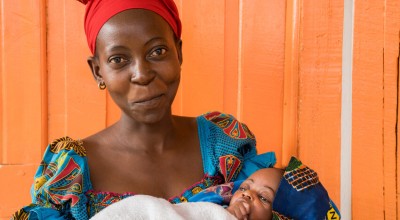 Esperance with her three week old daughter