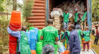 Concern staff members organise the distribution of household and hygiene kits as part of the SAFER programme, funded by FCDO. Photo: Samuel Isenge/Concern Worldwide