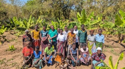 Concern Malawi Team standing with banana sucker recipients in Traditional Authority Ndamera in Nsanje District. Photo: Concern Worldwide.