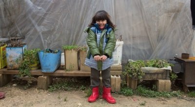 Syrian refugee Ola, wears her winter clothes that were distributed to her by the Concern team at the informal tented settlement in the village of Bebnine, in Akkar, north of Lebanon. Photographer: Dalia Khamissy
