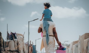 Man with child on his back