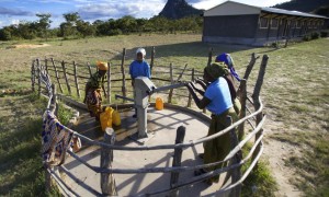 Members of the School Governing Council demonstrating clean water access at Chimbadzuo Primary School, Manica District, Mozambique. Photo: Kieron Crawley / Concern Worldwide.