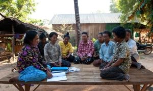 Local villagers attend a monthly Self Help Group set up by SORF (Concern's local NGO partner) in Pursat, Cambodia. Photo: Conor Wall / Concern Worldwide.
