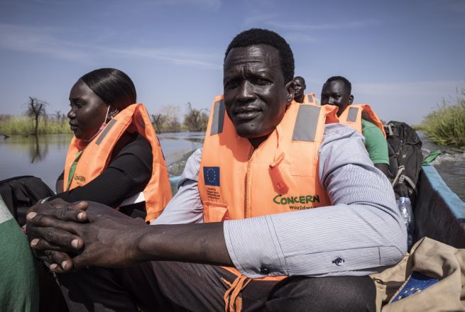 Gatkuoth Matai, Concern Disaster and Risk Reduction Officer, travels with colleagues to visit a community that was surrounded by flood water near Bentiu in Unity State, South Sudan. Photo: Ed Ram/Concern Worldwide
