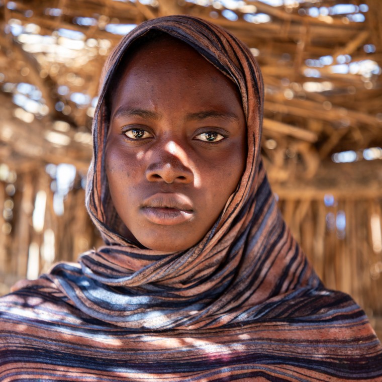 Dijda* (20) in her home in refugee camp in Eastern Chad. Dijda* received kitchen items from Concern Worldwide, as well as a mattress and blankets. (Photo: Eugene Ikua/Concern Worldwide)