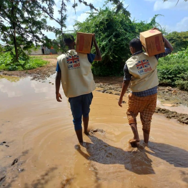 Concern and partner SHACDO staff deliver RUTF supplies on flooded roads due to El Niño. The current situations faced by health and nutrition staff who want to offer their assistance and provide Ready-to-Use Therapeutic Food (RUTF) to children who are malnourished. Photo: Concern Worldwide