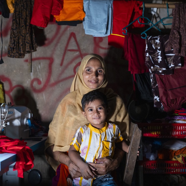 Renu with her son Ibrahim in her sewing room. Photo: Saikat Mojumder/Concern Worldwide