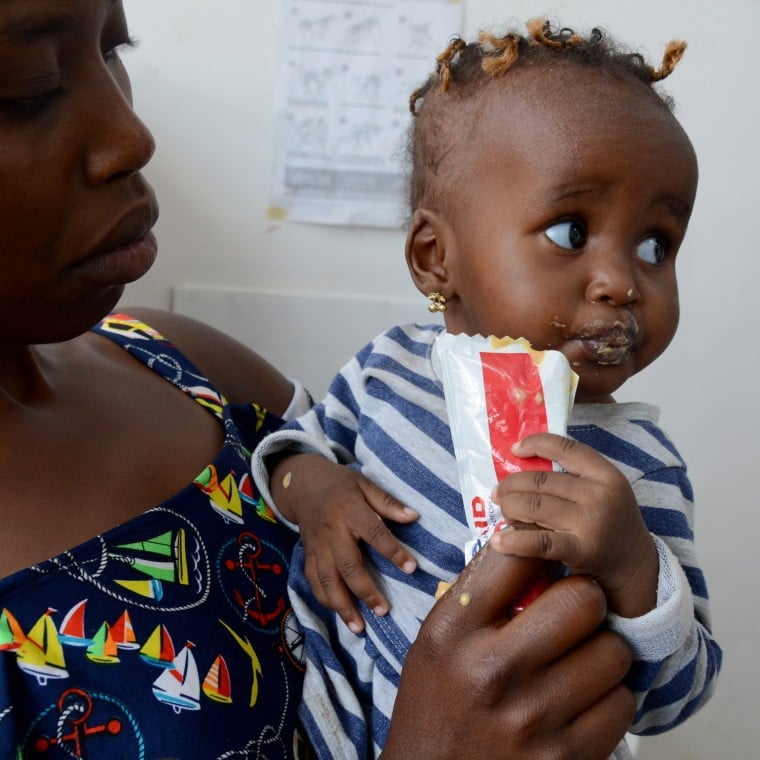 Susan* and her daughter Hawi* visit the Kayole Soweto health centre to measure her weight and height to asses for malnutrition.  Photo: Shaloam Strooper/Concern Worldwide